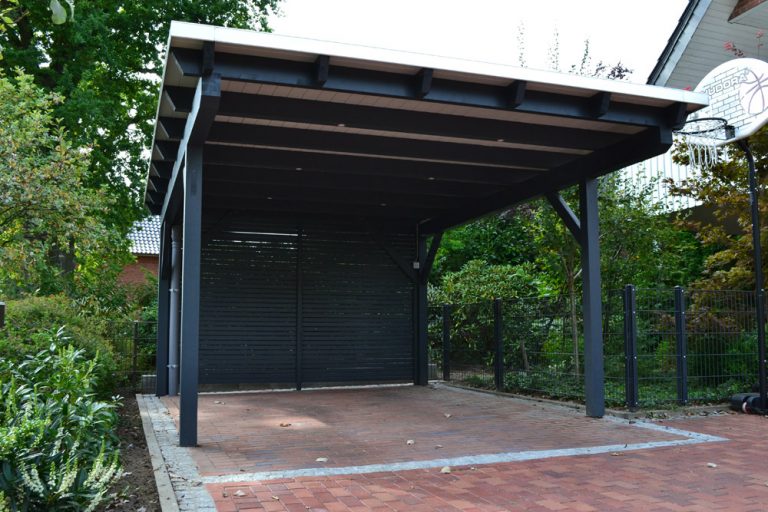 Flachdachcarport mit LED Beleuchtung in Rietberg Pollmeier Holzbau GmbH