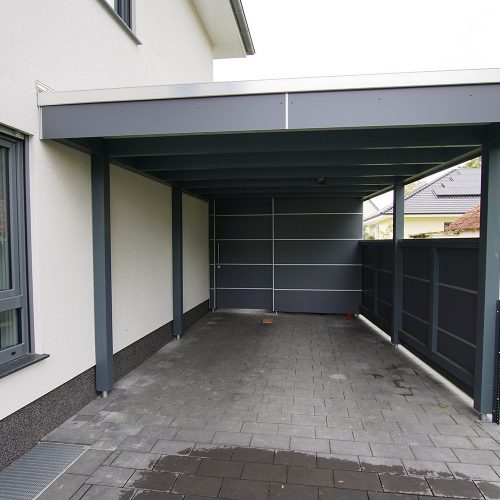 Flachdachcarport mit Abstellraum und HPL Platten in Verl